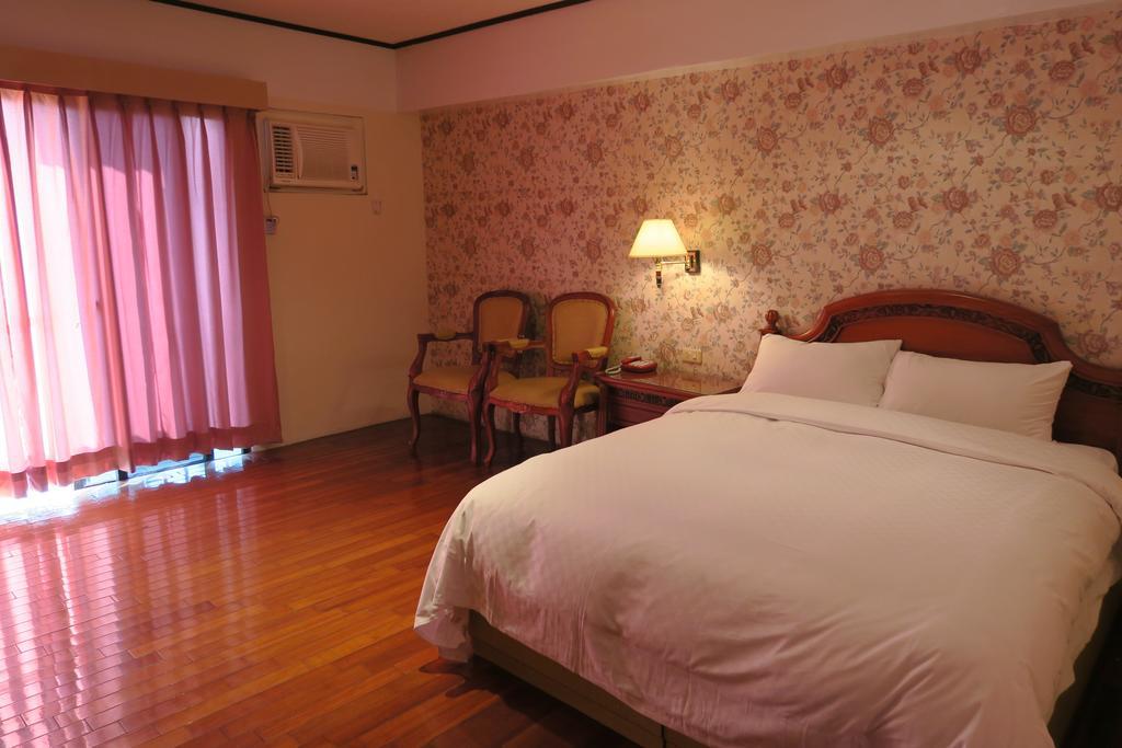 Champagne Hotel Цзяоси Номер фото