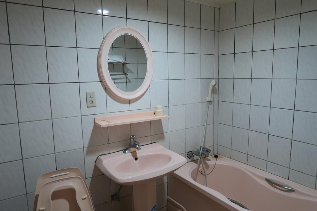 Champagne Hotel Цзяоси Номер фото
