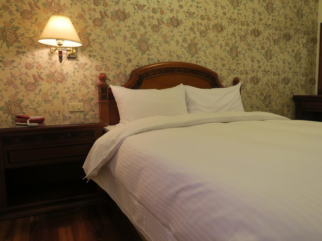 Champagne Hotel Цзяоси Номер фото