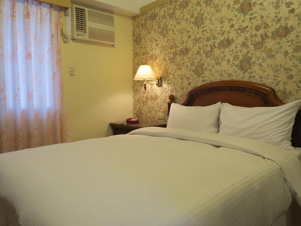Champagne Hotel Цзяоси Номер фото